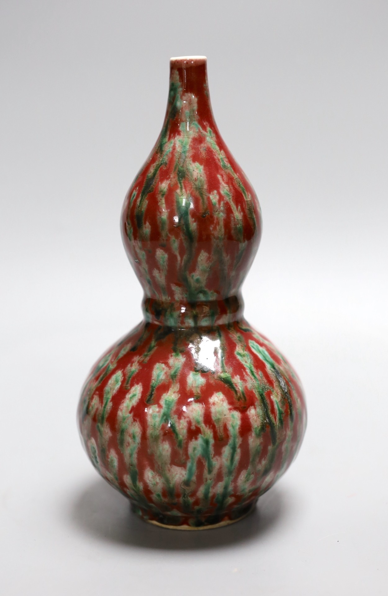 A Chinese flambé double gourd vase, 21 cms high